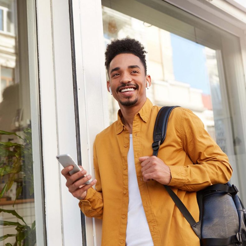 young-smiling-african-american-guy-in-yellow-shirt-W7AEH5D.jpg